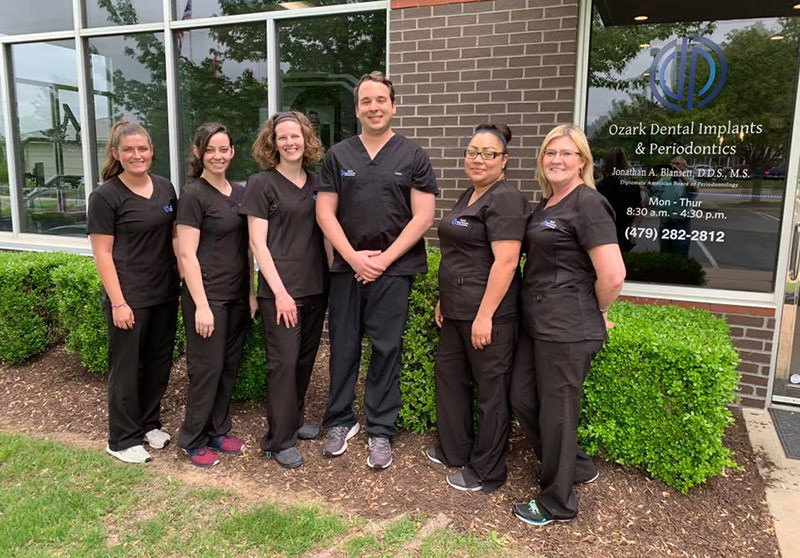 Dr. Blansett and staff in front of the office