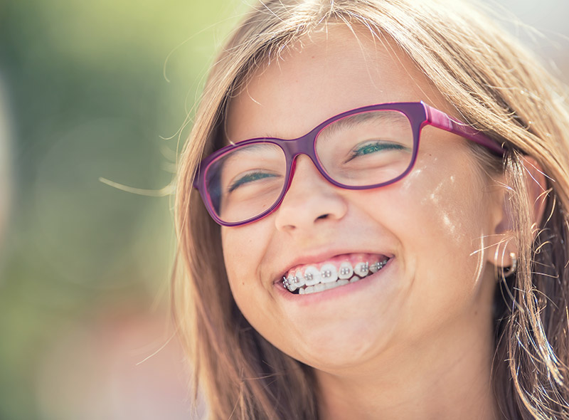 young girl in braces