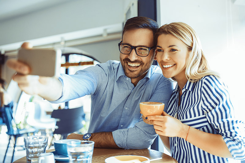 young couple taking selfie
