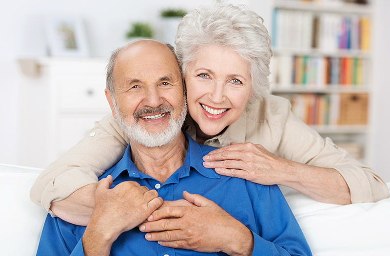 smiling elderly couple